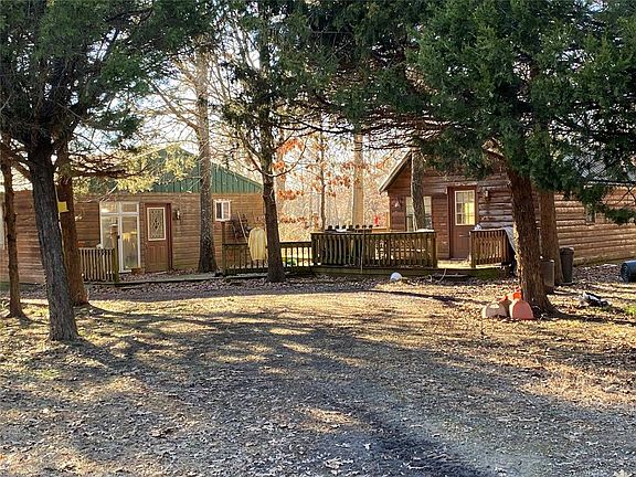 Image 4: Two cabins closer view, metal roofing