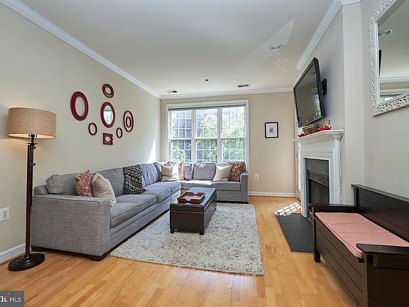 Sun filled living room with gas fireplace