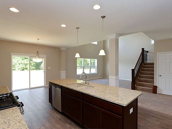 Breakfast area looks out to serene backyard.