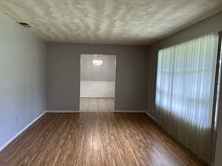 Formal Living room with swirl ceiling;
huge bay window;
View from the foyer