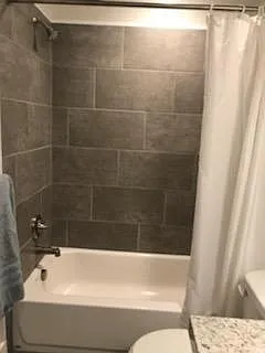 Upstairs bath (view toward shower/tub)
