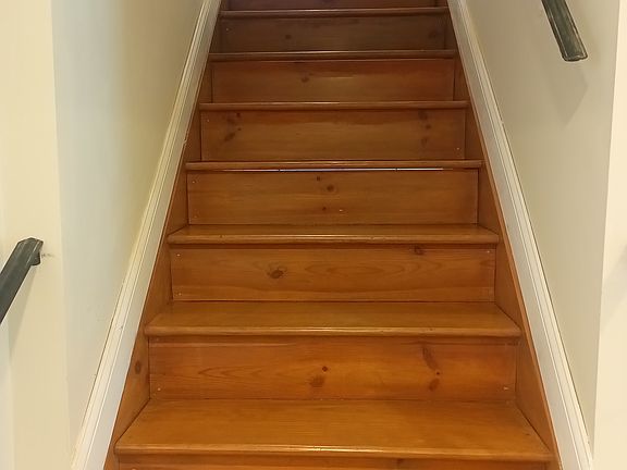 Four coats of finish. Custom iron railings.