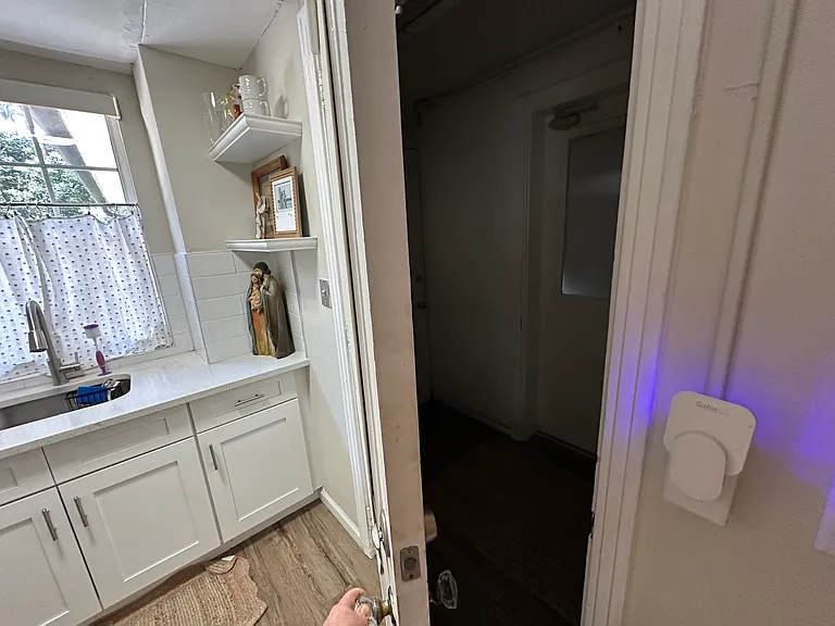 Exit to the hallway to the garage and where the washer and dryer are located for the unit