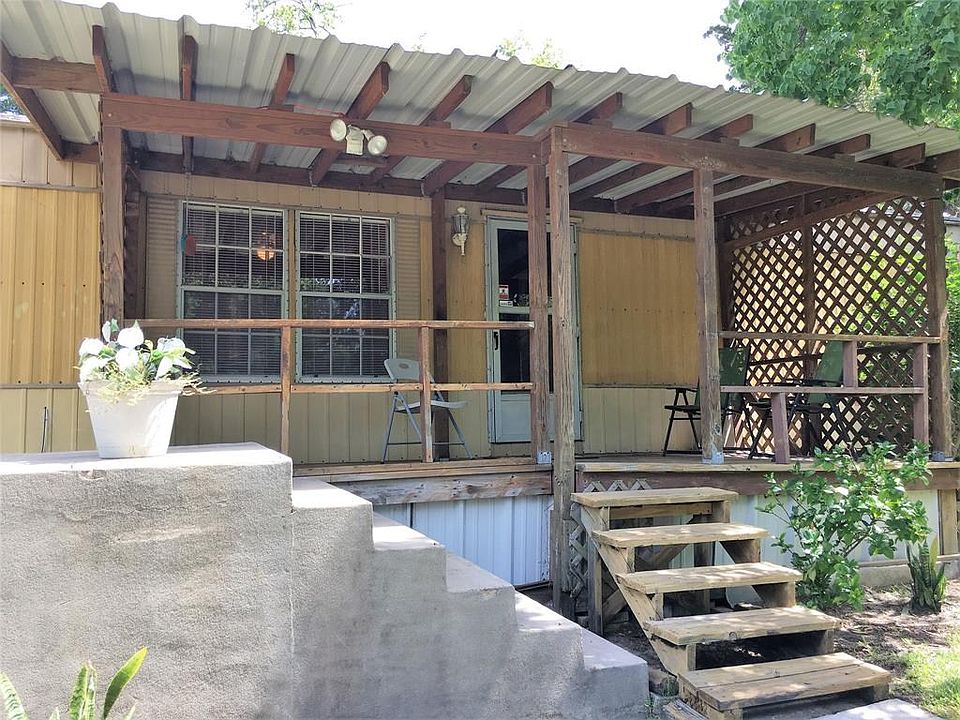 Enjoy sitting and watching the wildlife coming for the pecans from this covered front porch.