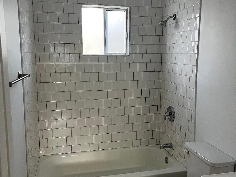 Entirely new bathroom, including plumbing. Octogon slate flooring and beautiful tub surround.