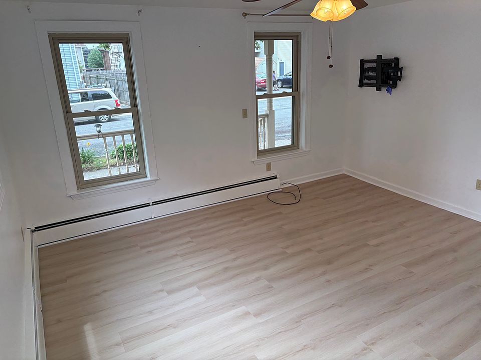 spacious living room with new vinyl flooring.