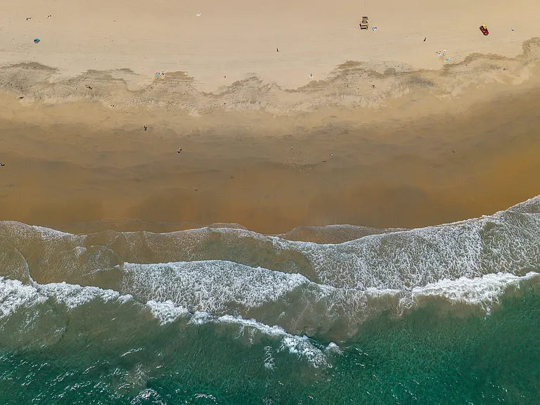 Waves meeting the shore along Newport Beach