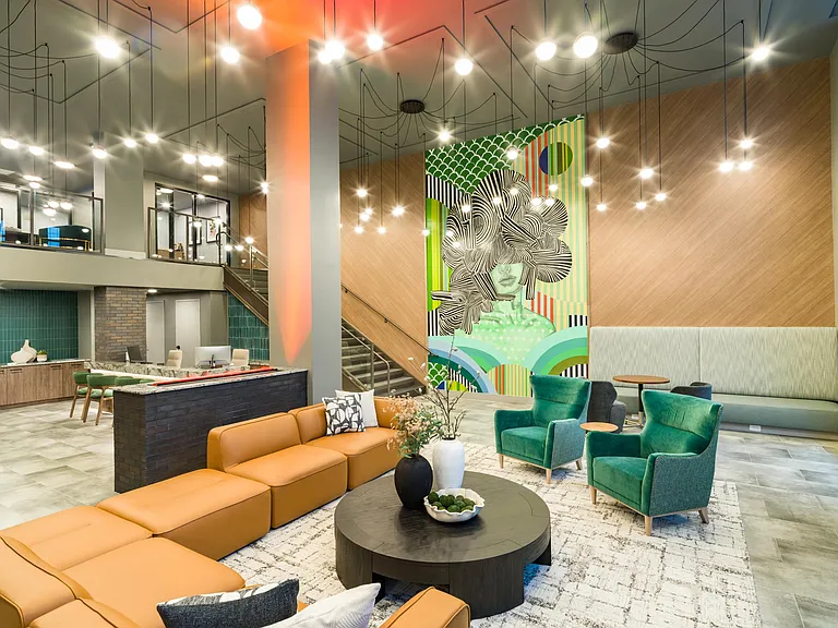 A vibrant resident lounge at Modera Westside Trail, where artful design and inviting seating meet easy access to Atlanta's Westside Trail and city energy.