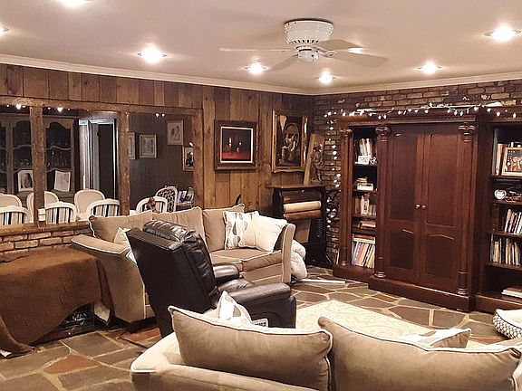 Large open floor plan with working fireplace slate floor and wet bar