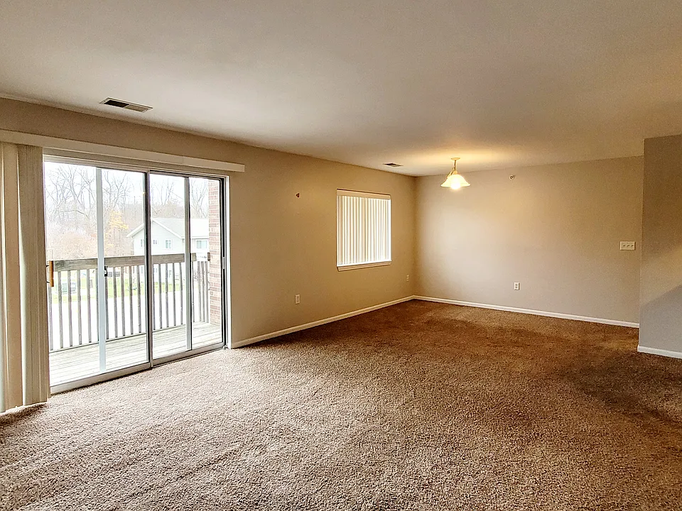 Open concept living/dining with slider access to patio