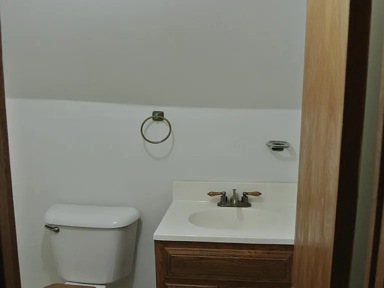 Upstairs half bathroom.