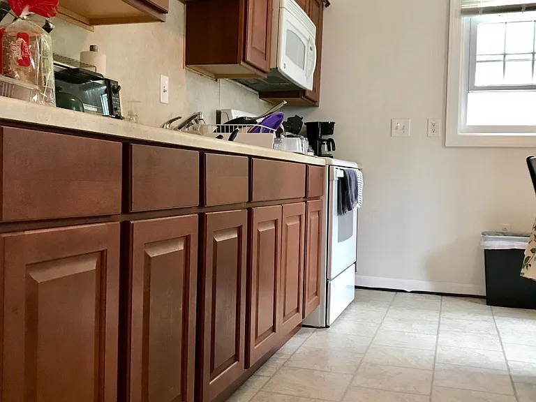 there is now a dishwasher directly to the left of the kitchen sink