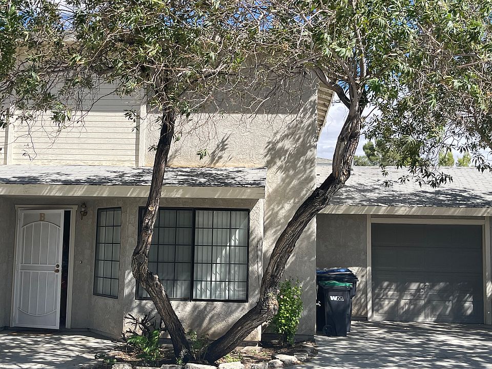 Unit B front door and 1 car garage with automatic opener.