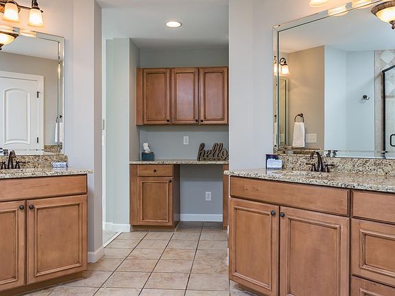 Primary Bedroom Master Bath with 2 vanities and make up seating area