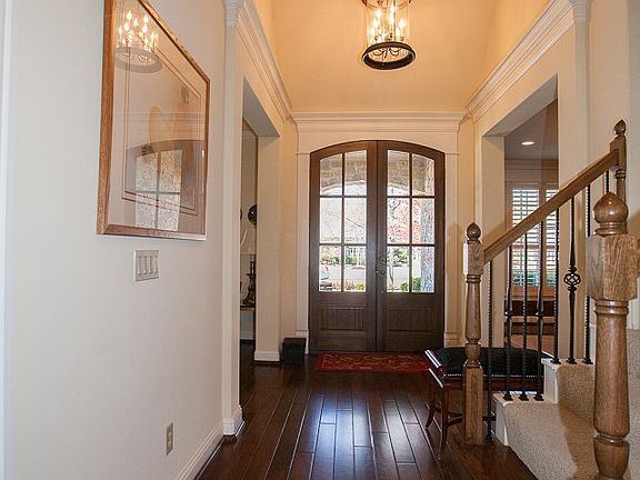 Welcoming foyer with hardwood floors