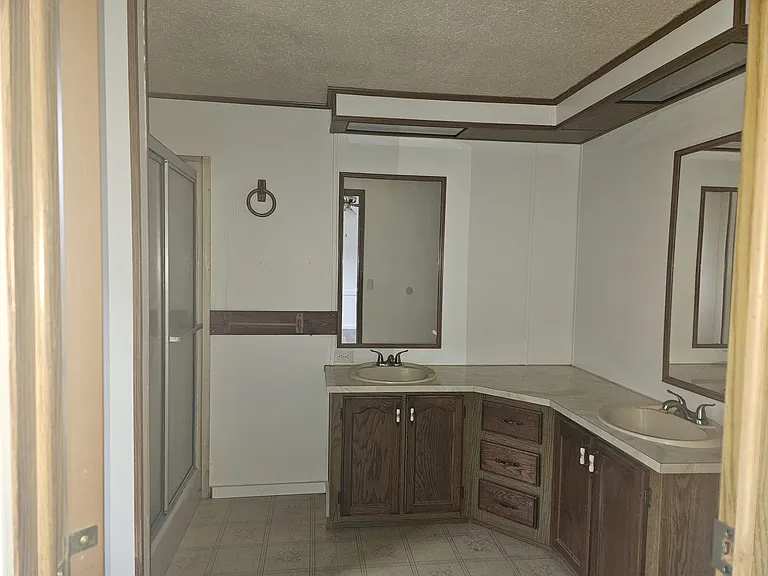 Master bathroom with large vanity area with his and hers double sinks.