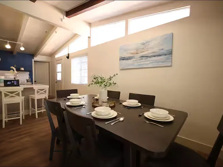 The dining room connects to the kitchen. There is also a bar counter.