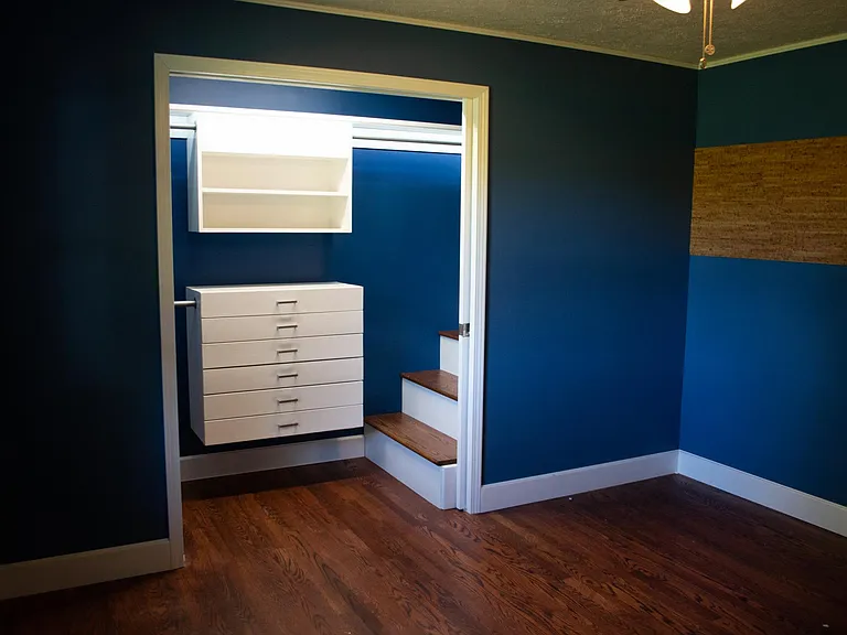 Bedroom 1 with walk-in closet unit.