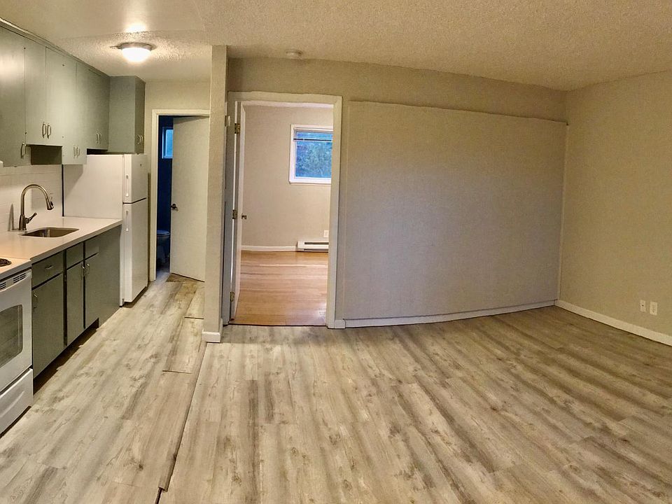 view of open apartment with new flooring