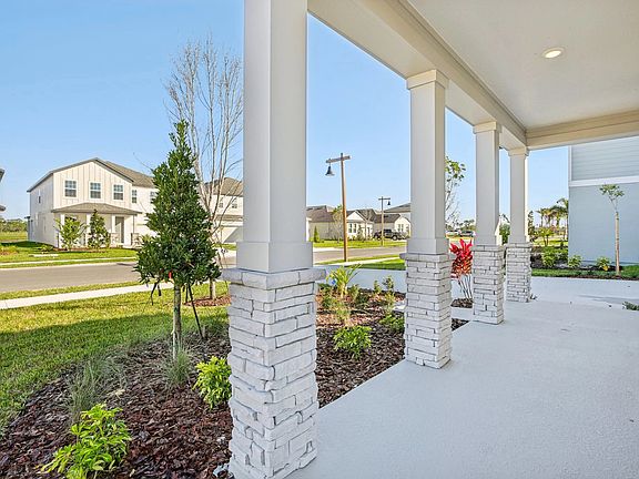 Monroe R elevation featuring a beautiful 4 post covered front porch