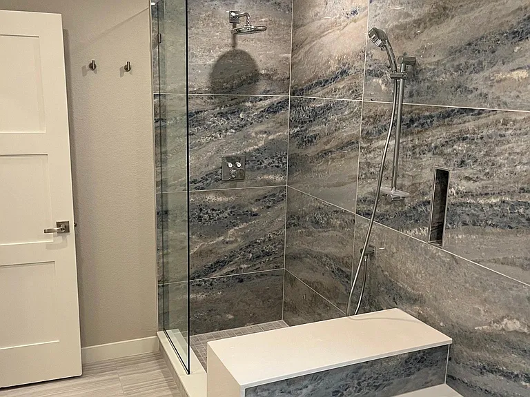 The bathroom of 1936 has a separate shower and tub w hand shower and push button controls. It's phenomenal.