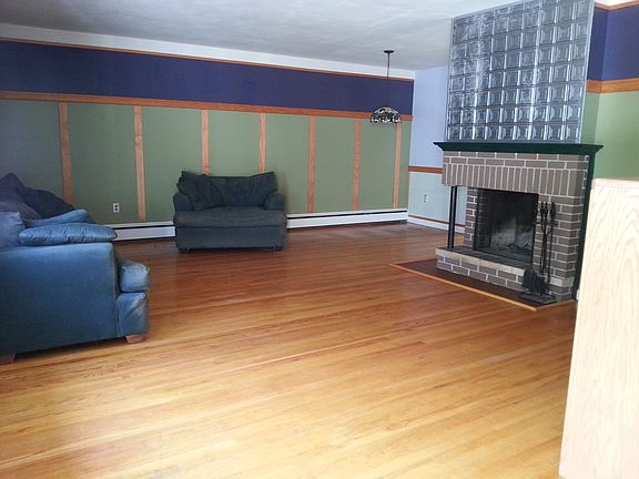 open dining room/living room with fireplace