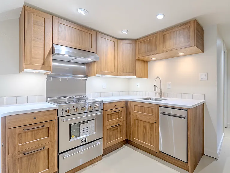 Brand new kitchen thoughtfully designed with ample cabinet space and stainless steel appliances