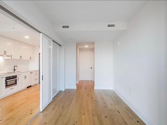 Sliding doors separate living room and bedroom.