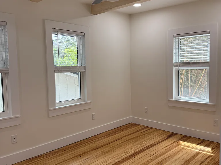 Sunny bedroom with A/C and fans