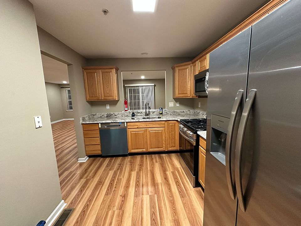 Kitchen with granite counter top, garbage disposer.