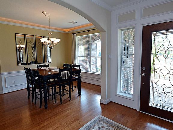 The elegant full length, leaded-glass door sets the tone for what is to come in this home.