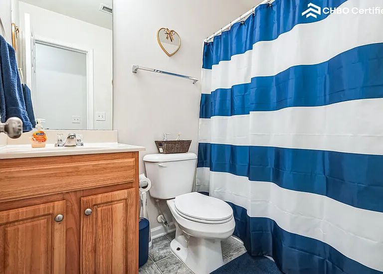 Secondary bathroom with shower and tub.