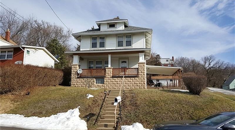 Large front and side covered porch.
