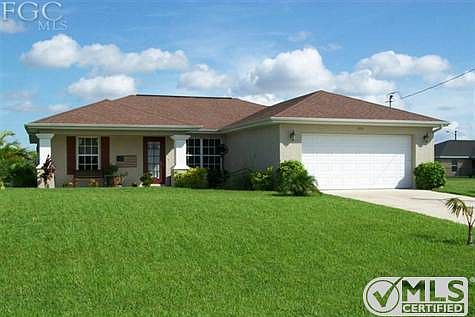 Great curb appeal with new sod, fresh exterior paint & nice landscaping.