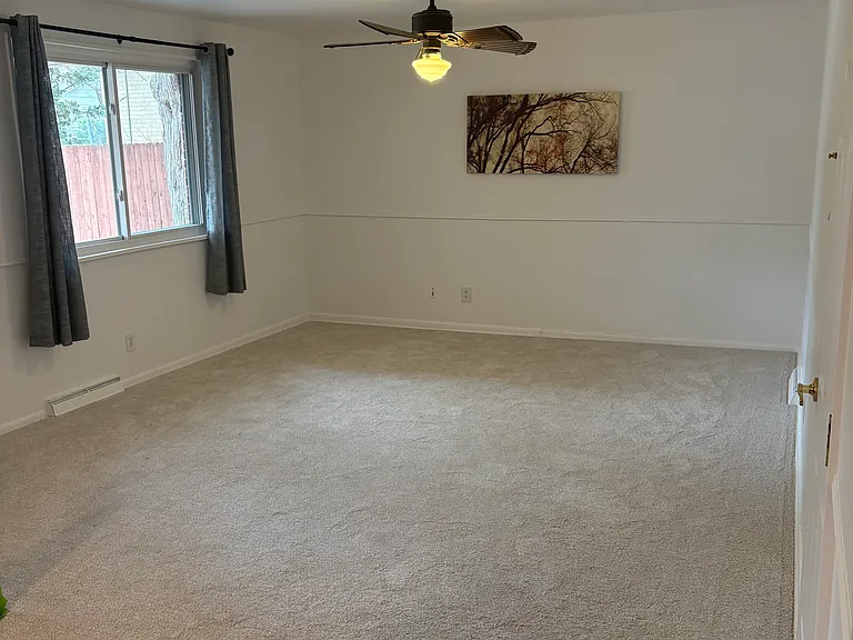 first floor large family room, window looking out to back patio. This view is from the kitchen