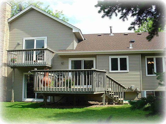 Large main floor deck over-looks private picturesque back yard.  