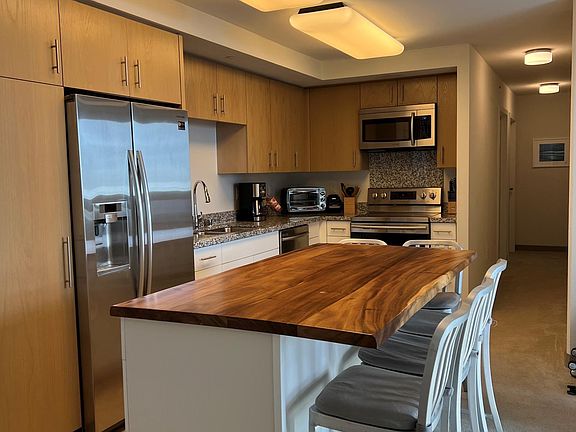 Kitchen with island and dining bar