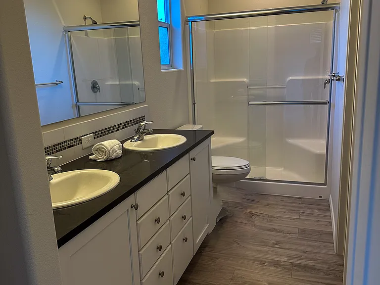 Dual Vanity Master Bath with Walk in Shower.