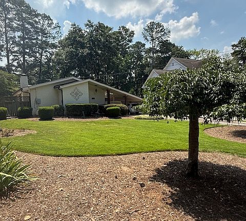 Spectacular Front View of Home Displaying Beautiful Blue Skies.