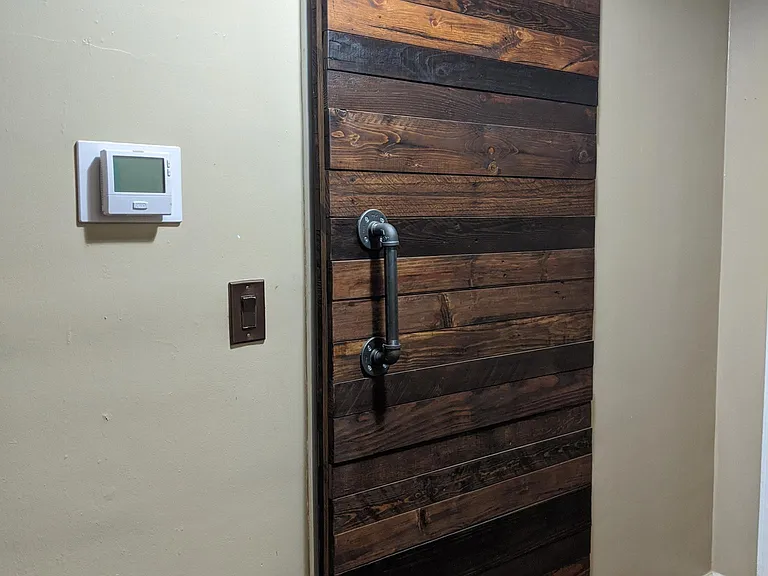 Handcrafted barn door on bathroom