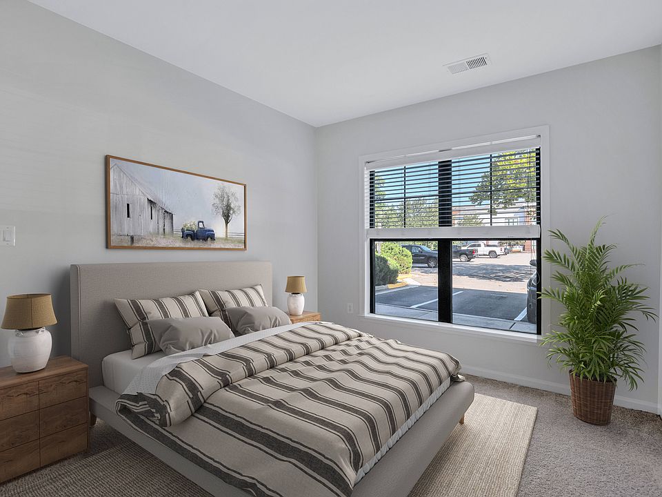 Spacious bedroom with plush carpeting