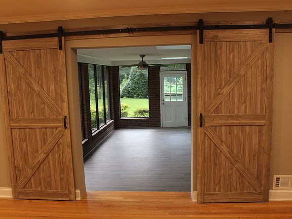 Double barn doors to sunroom