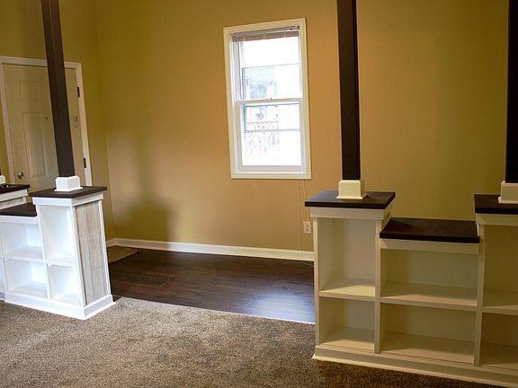Built in shelving in living area, new carpet, new paint.