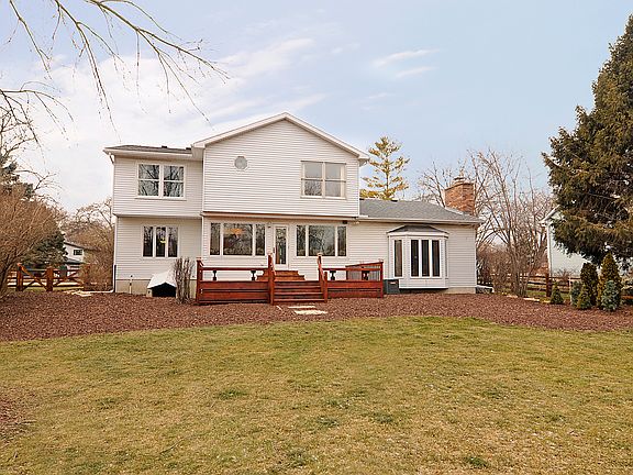 PANORAMIC VIEWS OF THE FOX RIVER, HUGE DECK, SHED AND FENCED YARD.