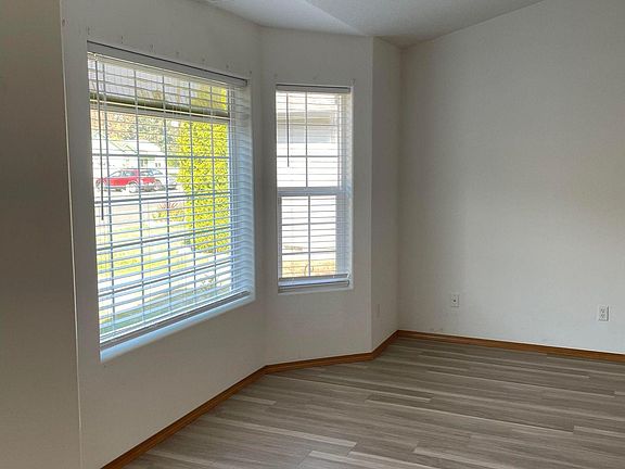 Large formal living with bay windows and family room off kitchen