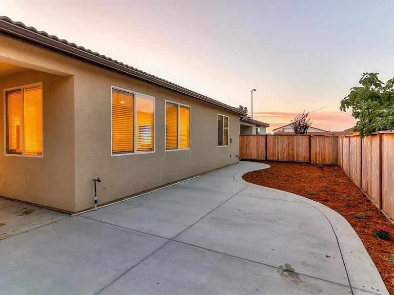 Low maintenance backyard with large patio.