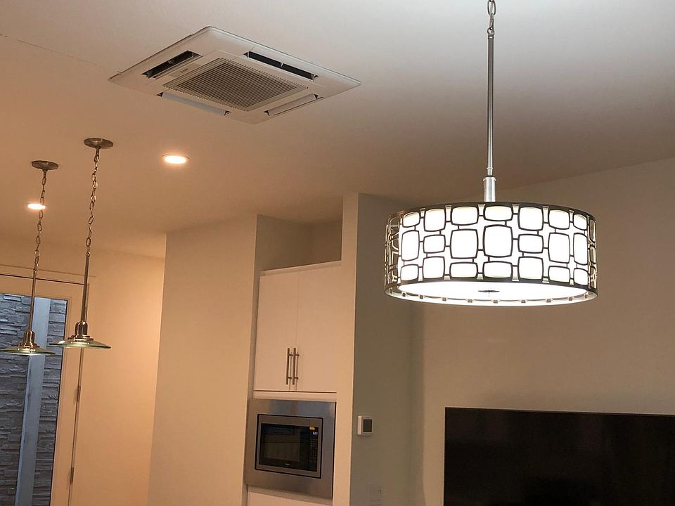 Other wall with microwave and cabinets