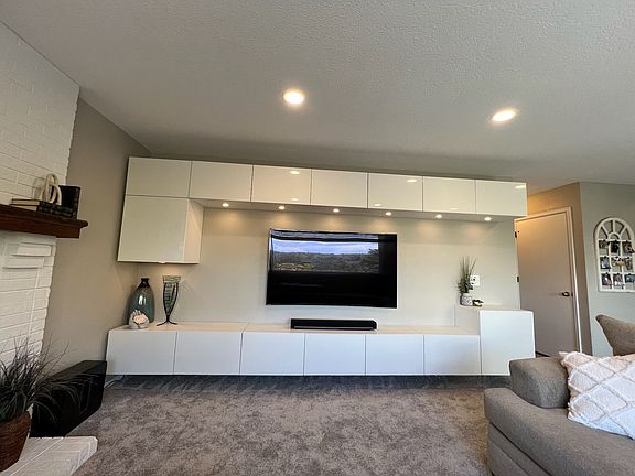 Living room with built-in cabinets for extra storage