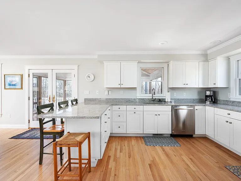 Kitchen with bar seating, Viking stove, and all the kitchen items you'll need.