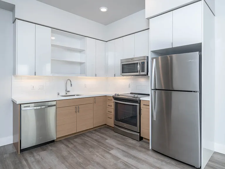Kitchen with Stainless Steel Appliances and Quartz Countertops